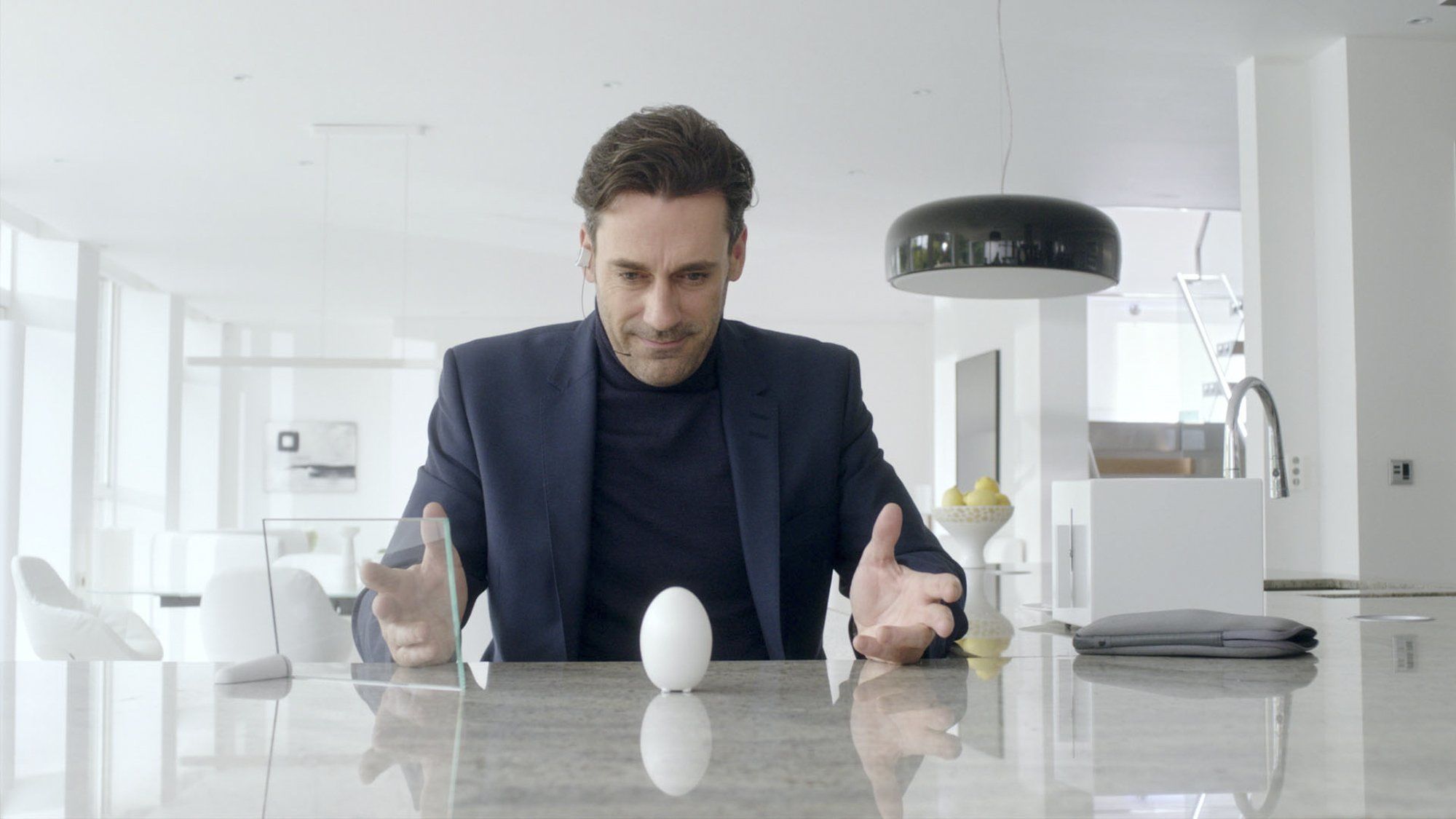 Man from Black Mirror's White Christmas episode, beholding an egg on a table